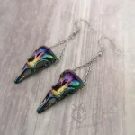 Earrings with rainbow bird skull pendants hanging on silver stainless steel chain, on silver stainless steel earring hooks