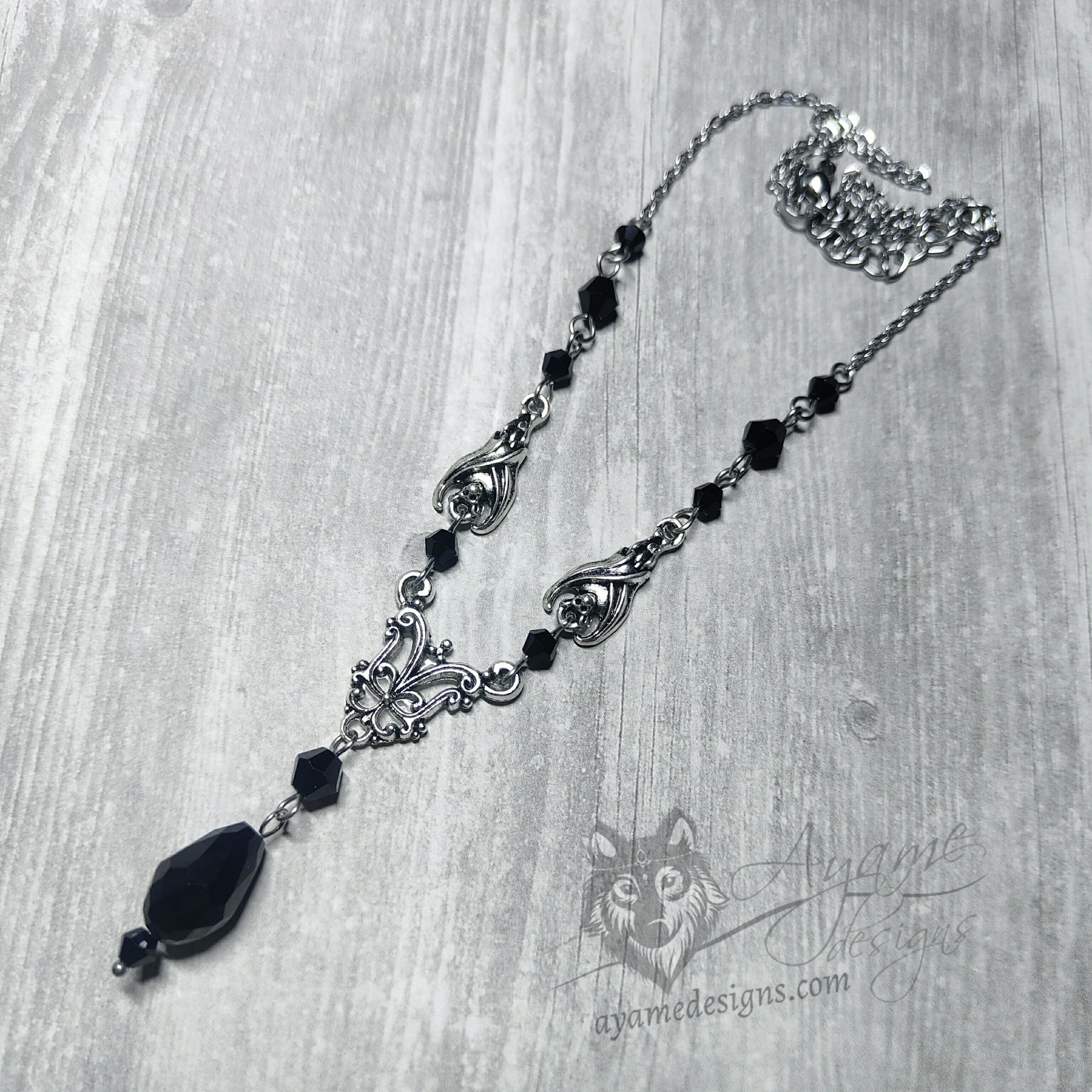 Adjustable gothic necklace with small bat and filigree charms, with black Austrian crystal beads and stainless steel chain