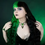 Gothic model wearing a handmade jewellery set with earrings, a beaded choker necklace and a hand bracelet