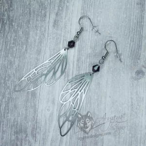 Handmade earrings with laser cut stainless steel fairy wing charms with purple Austrian crystal beads, on stainless steel earring hooks