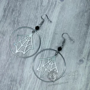 Handmade earrings with laser cut stainless steel spider web charms inside large stainless steel rings with black Austrian crystal beads, on stainless steel earring hooks