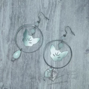 Handmade earrings with laser cut stainless steel cat pendants inside large rings, with white Austrian crystal beads, on stainless steel earring hooks