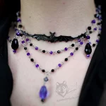 Handmade gothic choker necklace with a bat pendant and blue and black Austrian crystal beads