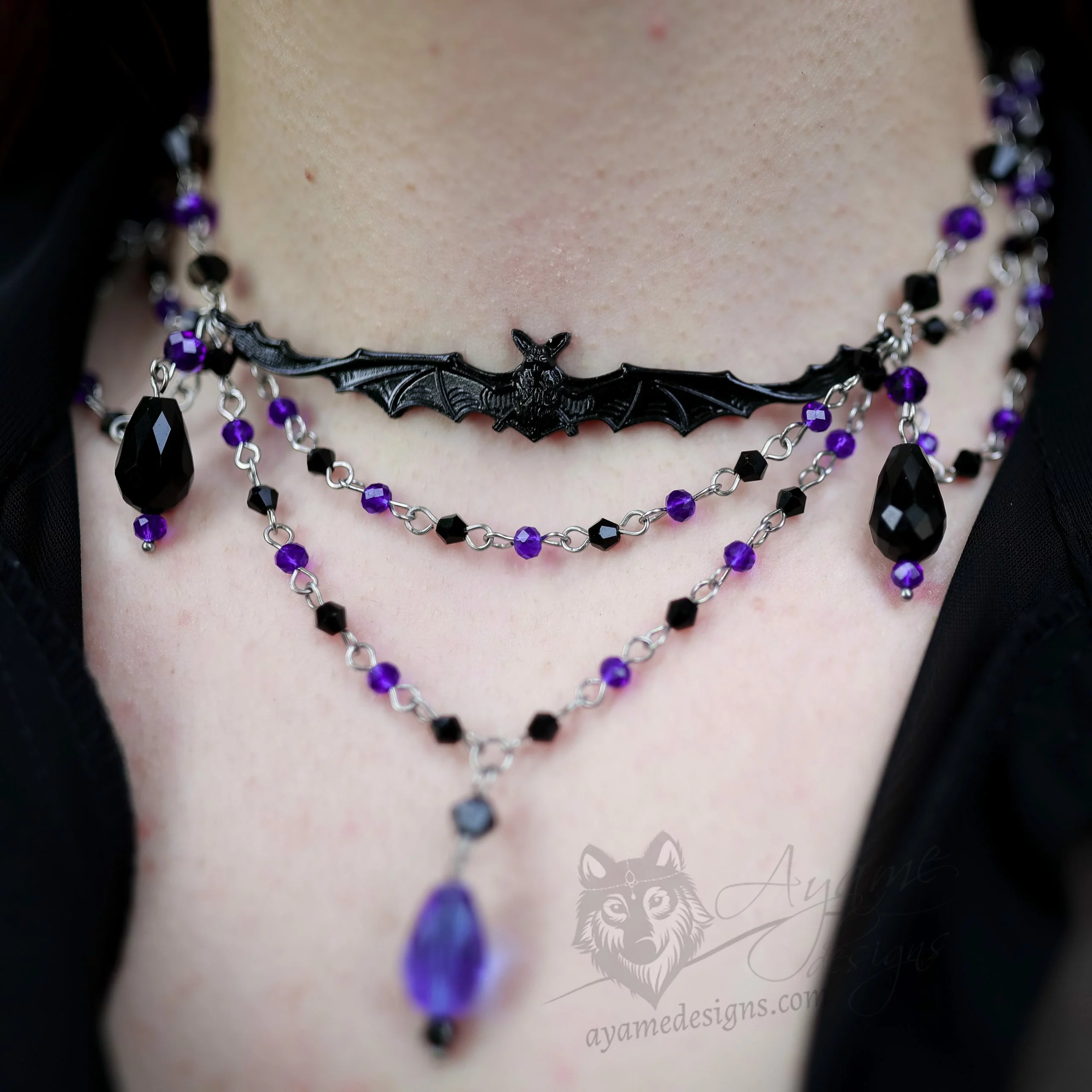 Handmade gothic choker necklace with a bat pendant and blue and black Austrian crystal beads