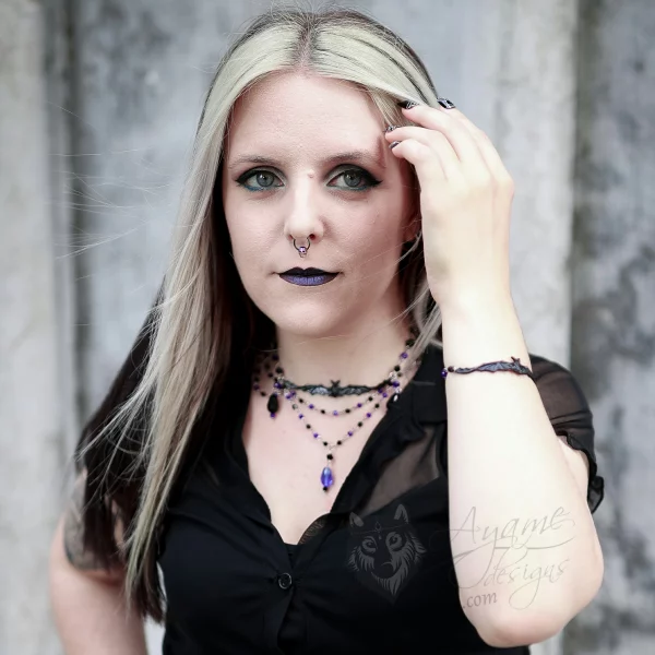 Gothic model wearing a bat jewellery set made with Austrian crystal beads