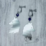Handmade earrings with laser cut stainless steel wolf pendants with blue Austrian crystal beads, on stainless steel clip on earrings for non-pierced ears