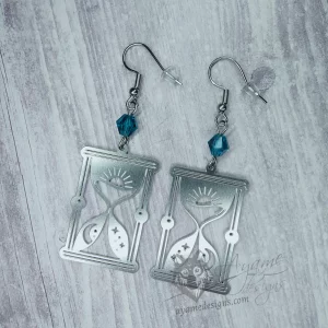 Handmade earrings with laser cut stainless steel hourglass charms with teal Austrian crystal beads, on stainless steel earring hooks