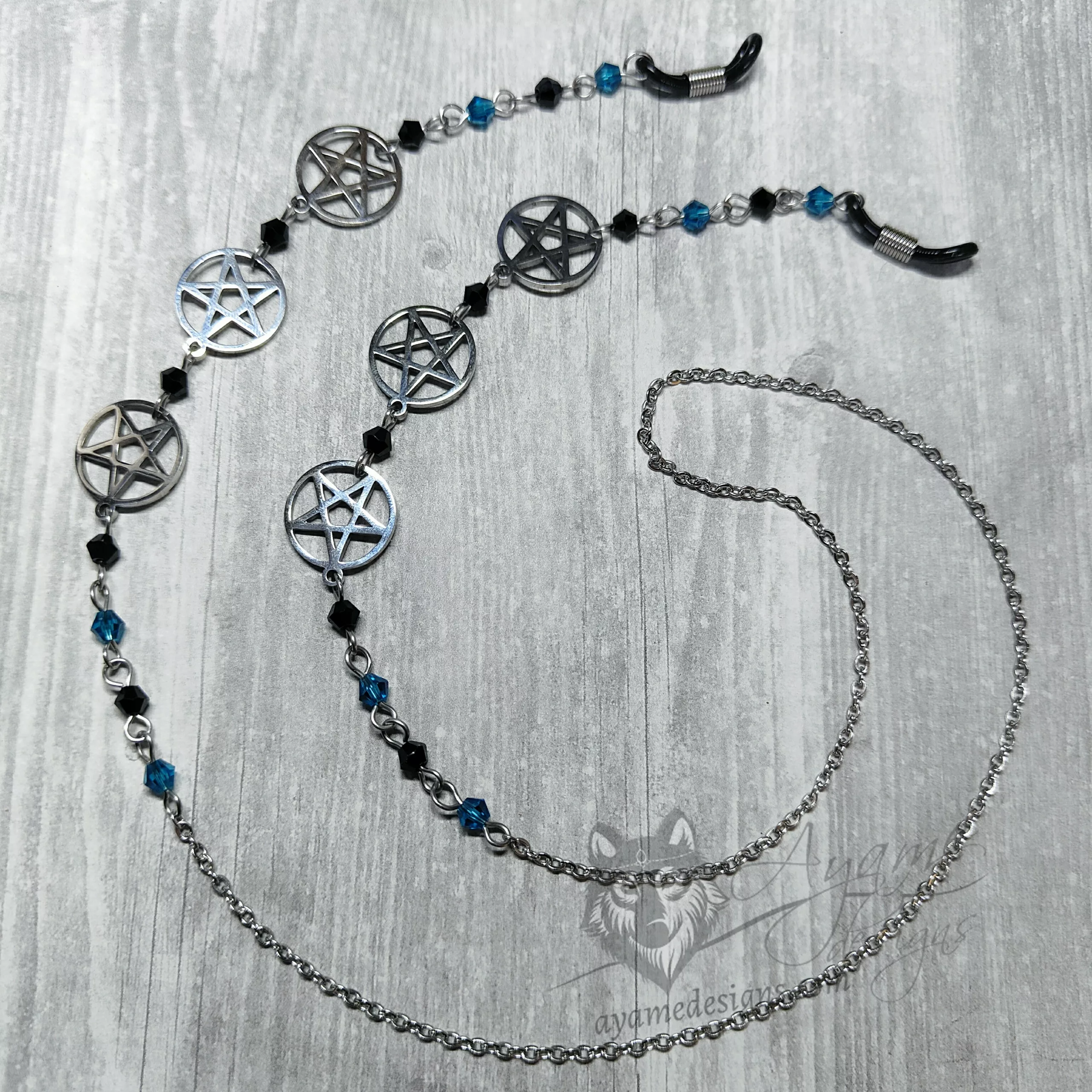 A handmade glasses chain made with laser cut stainless steel pentacle pendants (three on each side), Austrian crystal beads and stainless steel chain