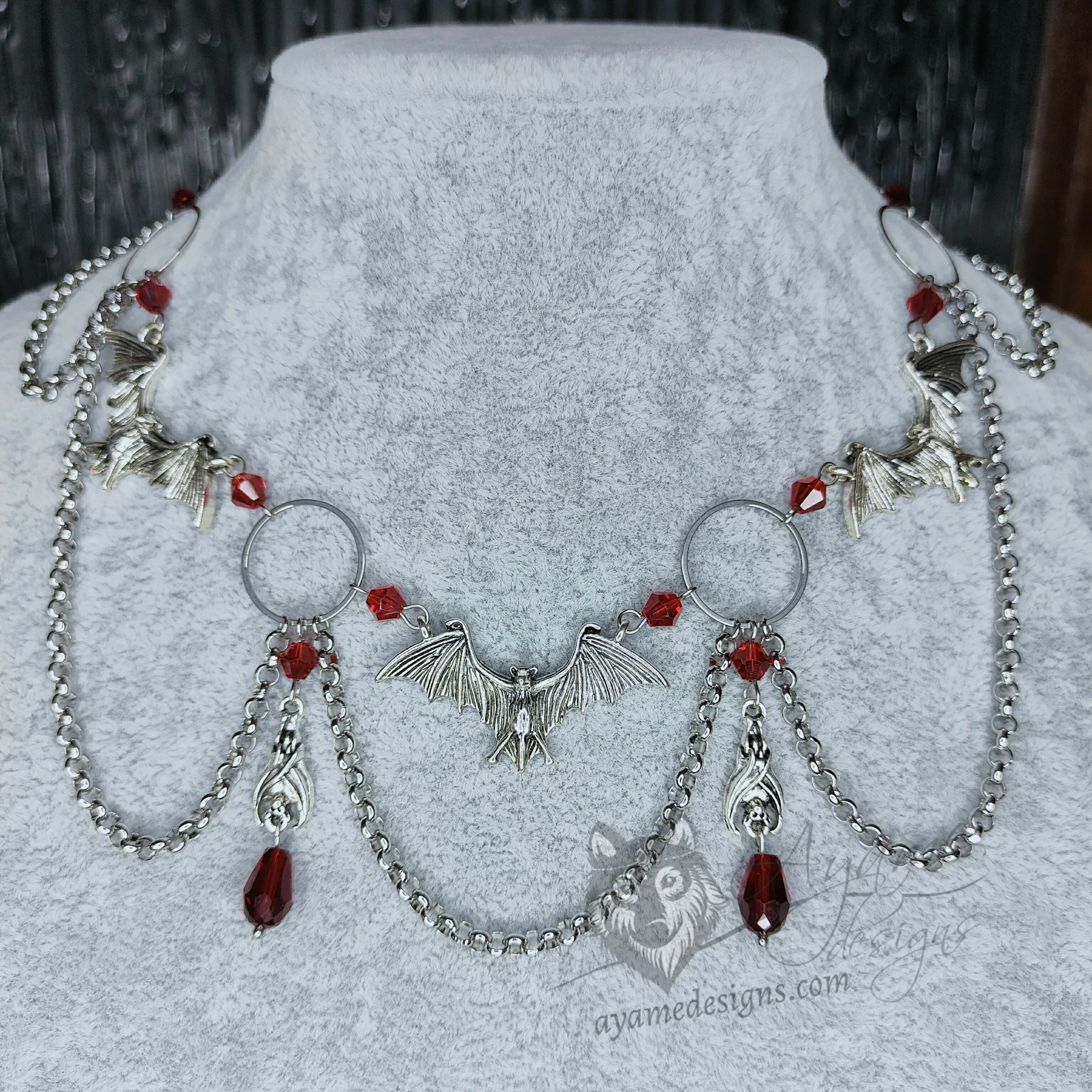 Handmade gothic necklace with large bat pendants, o-rings, red Austrian crystal beads and stainless steel chain details
