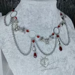 Handmade gothic necklace with large bat pendants, o-rings, red Austrian crystal beads and stainless steel chain details