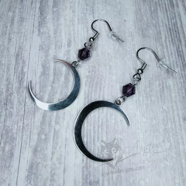 Handmade earrings with silver laser cut stainless steel moon charms with purple Austrian crystal beads, on stainless steel earring hooks