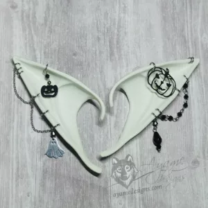 White elf ears with silver chains, black beads, and jack-o-lantern and ghost charms