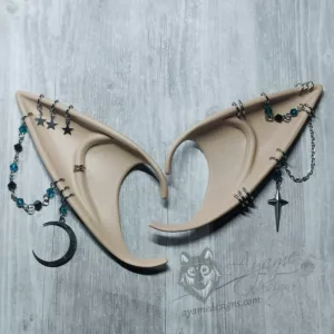 Beige elf ears with silver chains and rings, teal blue and black glass beads and crescent moon and star charms