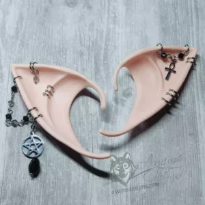Pink tone beige elf ears with silver chains and rings, black and grey glass beads and a pentacle and an ankh charm