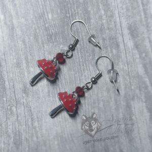 Handmade cottagecore earrings with red enamelled mushroom charms, red Austrian crystal beads and stainless steel earring hooks