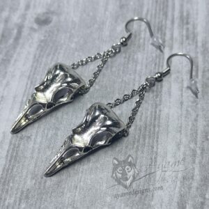 Earrings with bird skull pendants hanging on stainless steel chain, on stainless steel earring hooks